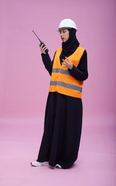 Saudi Female Engineer with Walkie Talkie and Safety Gear