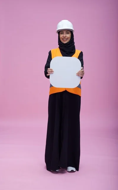 Saudi Female Engineer Holding Blank Sign on Pink Background