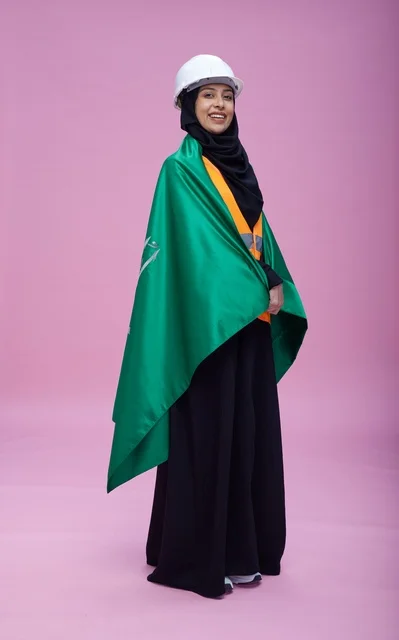 Saudi Female Engineer in Safety Gear with National Flag