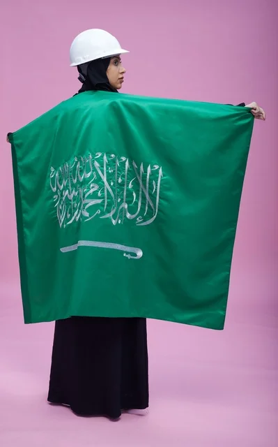 Saudi Female Engineer with Flag on Pink Background