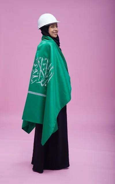 Saudi Female Engineer with National Flag and Hard Hat