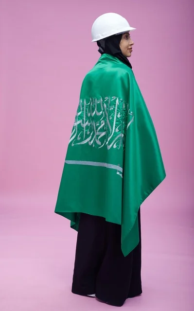 Saudi Female Engineer with National Flag and Hard Hat