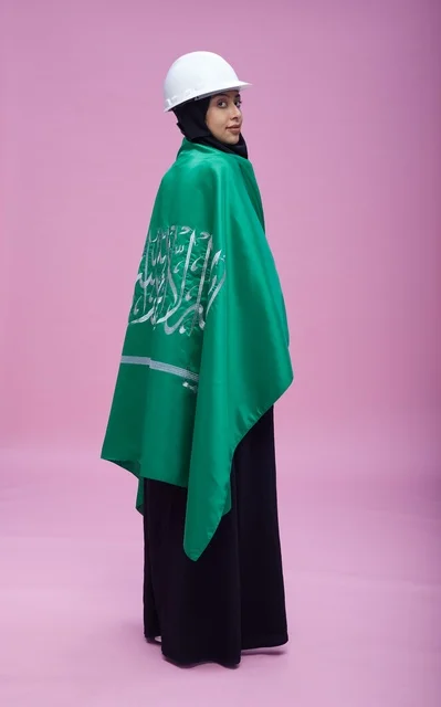 Saudi Female Engineer with National Flag and Helmet