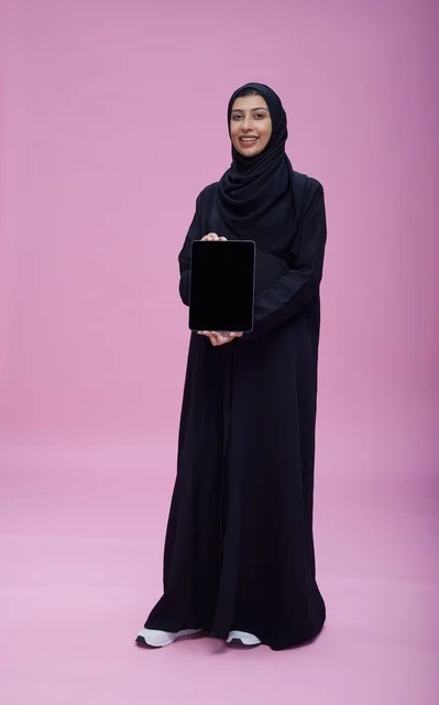 Saudi Woman in Abaya Holding Tablet with Blank Screen