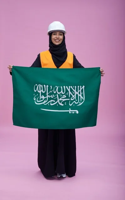 Saudi Female Engineer Holding Flag on Pink Background