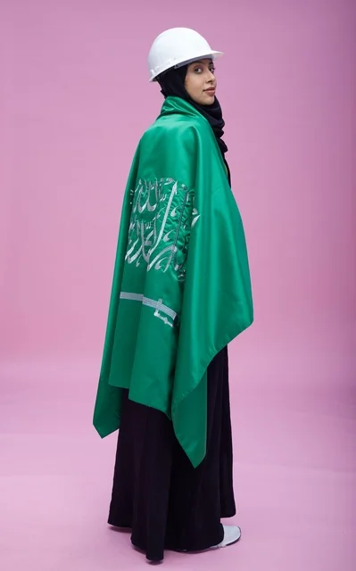Saudi Female Engineer with Flag on Pink Background