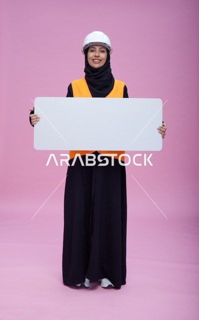 Saudi Female Engineer with Blank Signboard on Pink