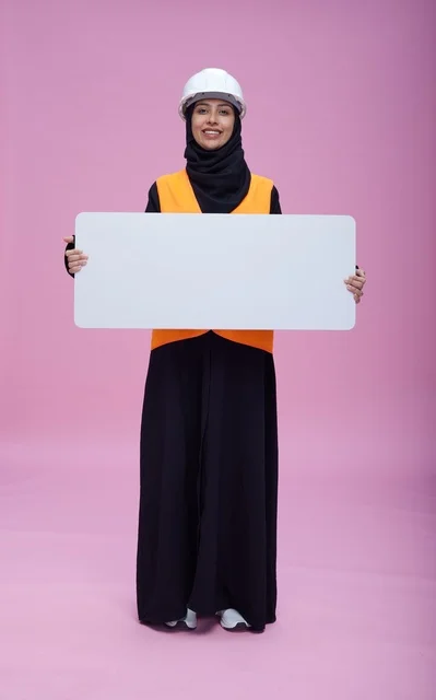 Saudi Female Engineer with Blank Signboard on Pink