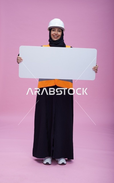 Saudi Female Engineer Holding Blank Sign Pink Background