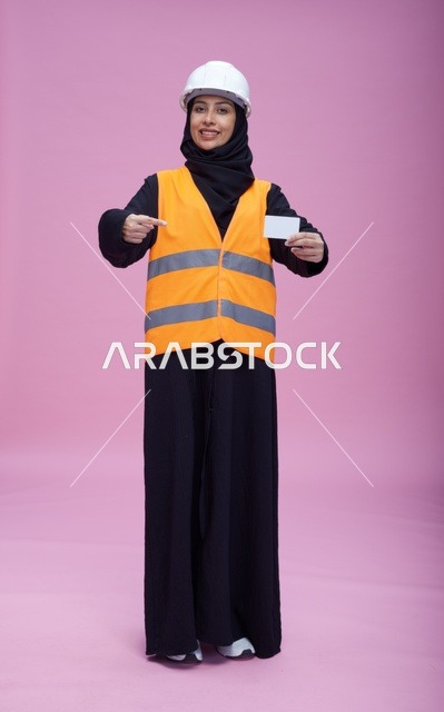 Saudi Female Engineer in Studio Holding Blank Card