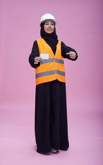Saudi Woman Engineer Holding Blank Card in Studio