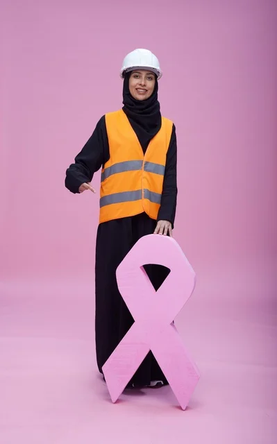 Saudi Female Engineer with Pink Ribbon Awareness Symbol