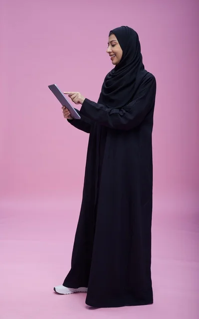 Saudi Woman Using Digital Tablet in Studio
