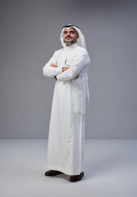 Saudi Man in Traditional Thobe with Crossed Arms