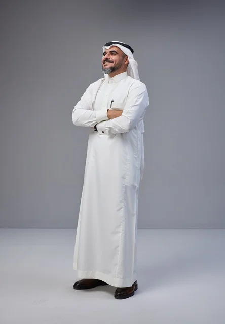 Saudi Man in Traditional Thobe Standing with Crossed Arms