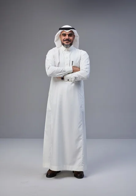 Saudi Man in Traditional Thobe with Arms Crossed
