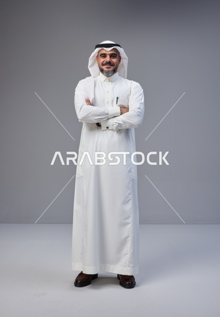 Saudi Man in Traditional Thobe and Ghutra Standing