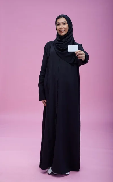 Saudi Woman in Abaya Holding Blank Card