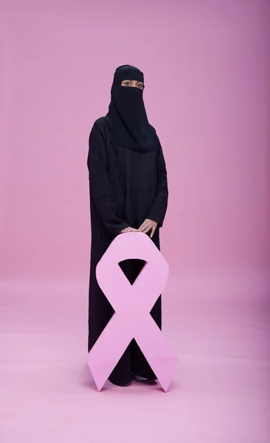 Saudi Woman in Niqab with Pink Breast Cancer Ribbon