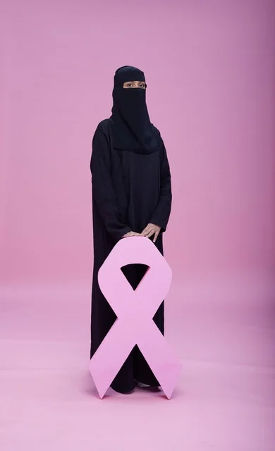 Saudi Woman in Niqab with Breast Cancer Pink Ribbon