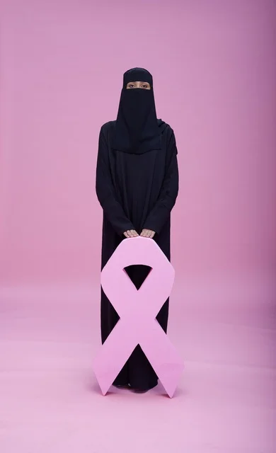 Saudi Woman with Breast Cancer Awareness Ribbon