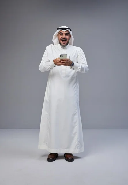 Surprised Saudi Man Using Smartphone in Studio