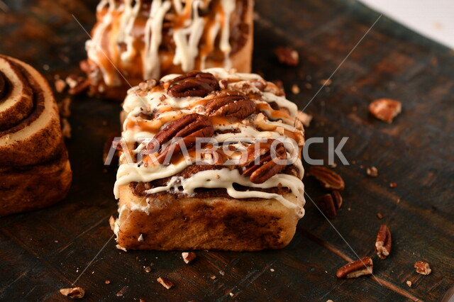 Close-up of delicious cinnamon rolls, cinnabon rolls, pastries, fresh baked goods, delicious dessert rolls