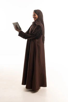 Saudi Woman in Brown Abaya Using Digital Tablet