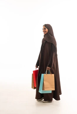 Saudi Woman with Shopping Bags in Brown Abaya