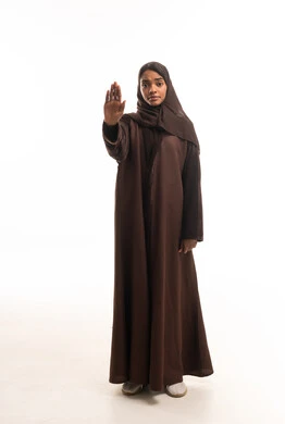 Sudanese Woman in Brown Abaya Making Stop Gesture