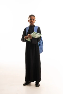 Saudi Boy in Black Thobe with School Backpack