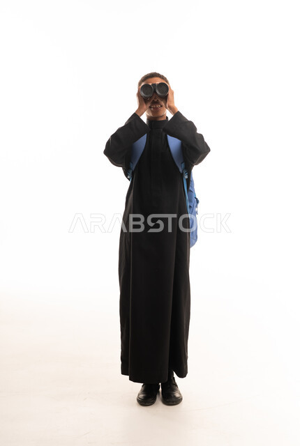 Saudi Man in Black Thobe Using Binoculars in Studio