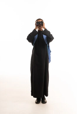 Saudi Man in Black Thobe Using Binoculars in Studio