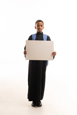 Sudanese Boy in Black Thobe Holding Blank White Sign