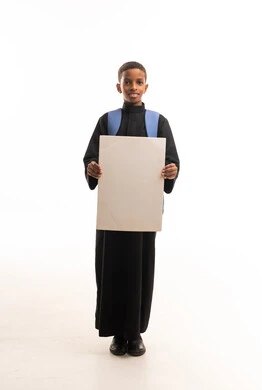 Saudi Boy in Black Thobe Holding Blank Board