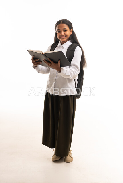 Saudi School Girl Holding Book on White Background