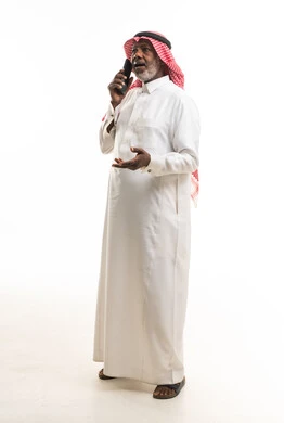 Elderly Saudi Man Talking on Smartphone in Thobe