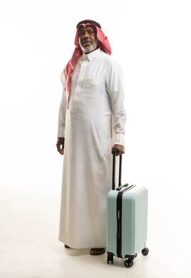 Elderly Saudi Man with Suitcase on White Background