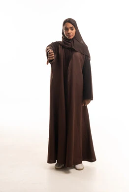Saudi Woman in Brown Abaya Making Thumbs Down Gesture