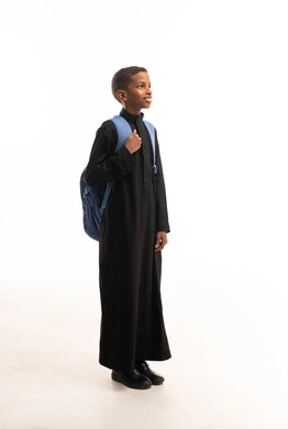 Saudi Boy in Black Thobe with School Backpack