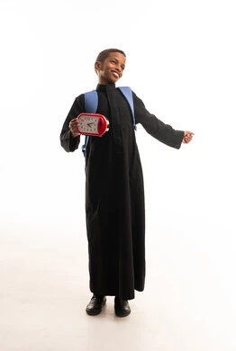 Saudi Boy in Black Thobe with School Backpack and Clock