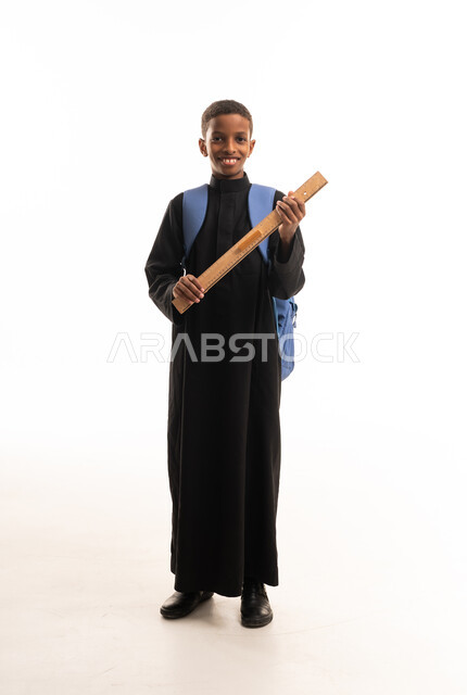 Sudanese Student in Black Thobe with School Ruler
