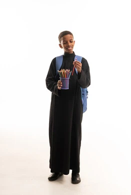 Saudi Boy in Black Thobe with School Supplies