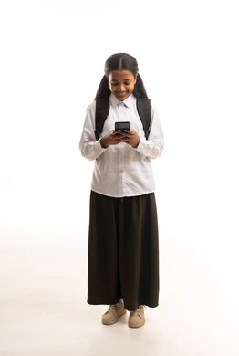 Saudi Schoolgirl Using Smartphone on White Background