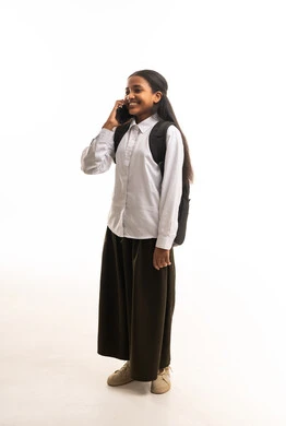 Saudi Schoolgirl with Backpack Using Smartphone