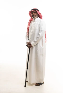 Elderly Saudi Man in Traditional Thobe with Walking Stick