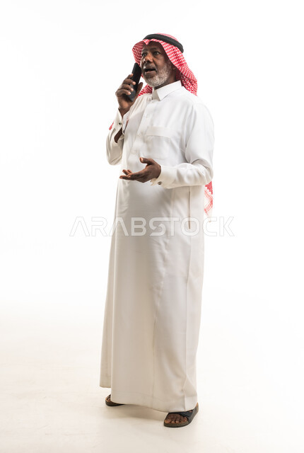 Senior Saudi Man Talking on Smartphone in Studio