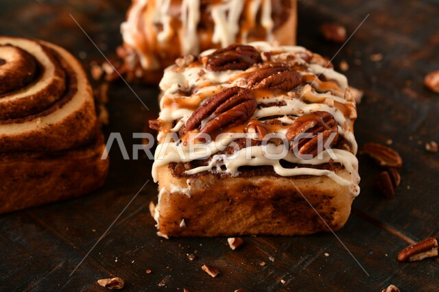 Close-up of delicious cinnamon rolls, cinnabon rolls, pastries, fresh baked goods, delicious dessert rolls
