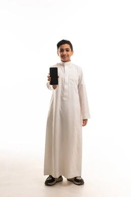 Saudi Boy in White Thobe Holding Smartphone Studio Shot