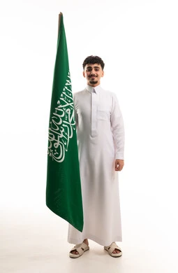 Saudi Man Holding National Flag on White Background